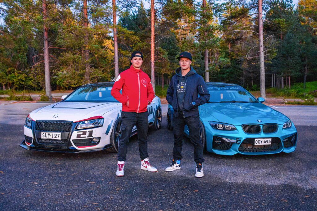 Liupakka brothers with their cars